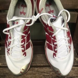 Under Armour Micro G football shoes red and white.